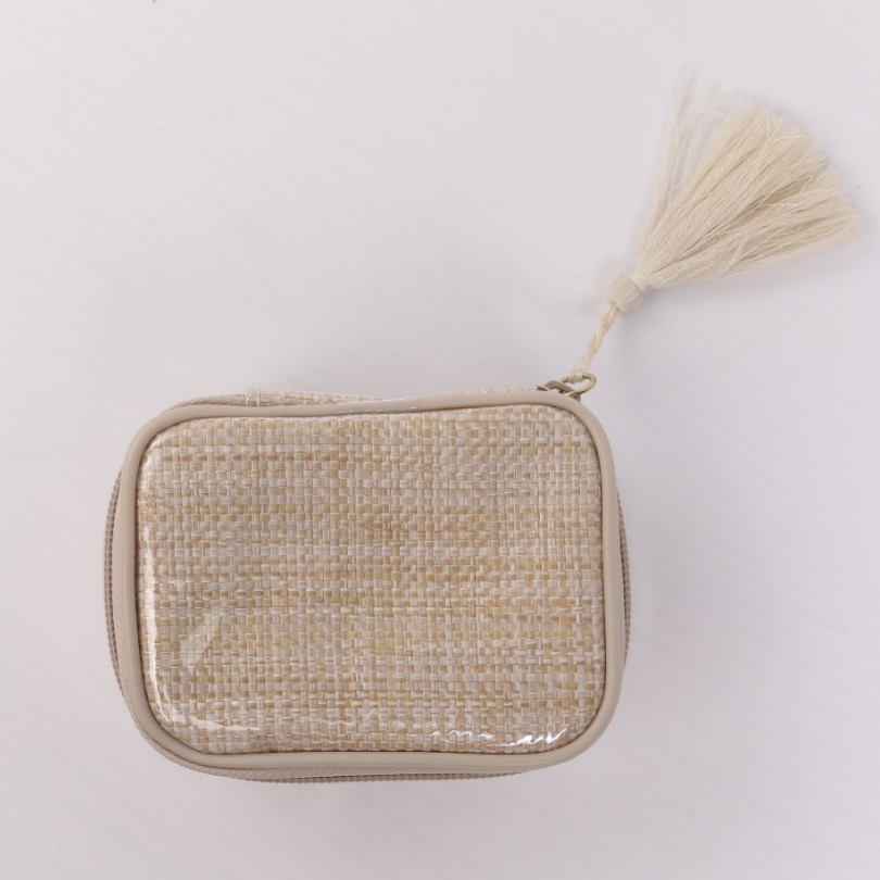 ALT Top-down view of a 3D square woven storage bag with a transparent PVC coating over a beige and white woven pattern, featuring featuring