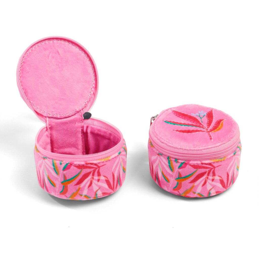 ALT A pink velvet jewelry organizer shown open to reveal the interior compartment and closed to show the embroidered lid and printed body, highlighting the zipper closure and compact