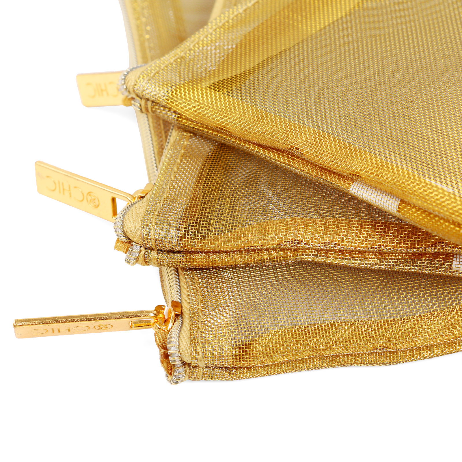 ALT Close-up of a gold mesh pouch showing two zippered compartments with gold-tone zipper pulls engraved with the word CHIC and a heart symbol