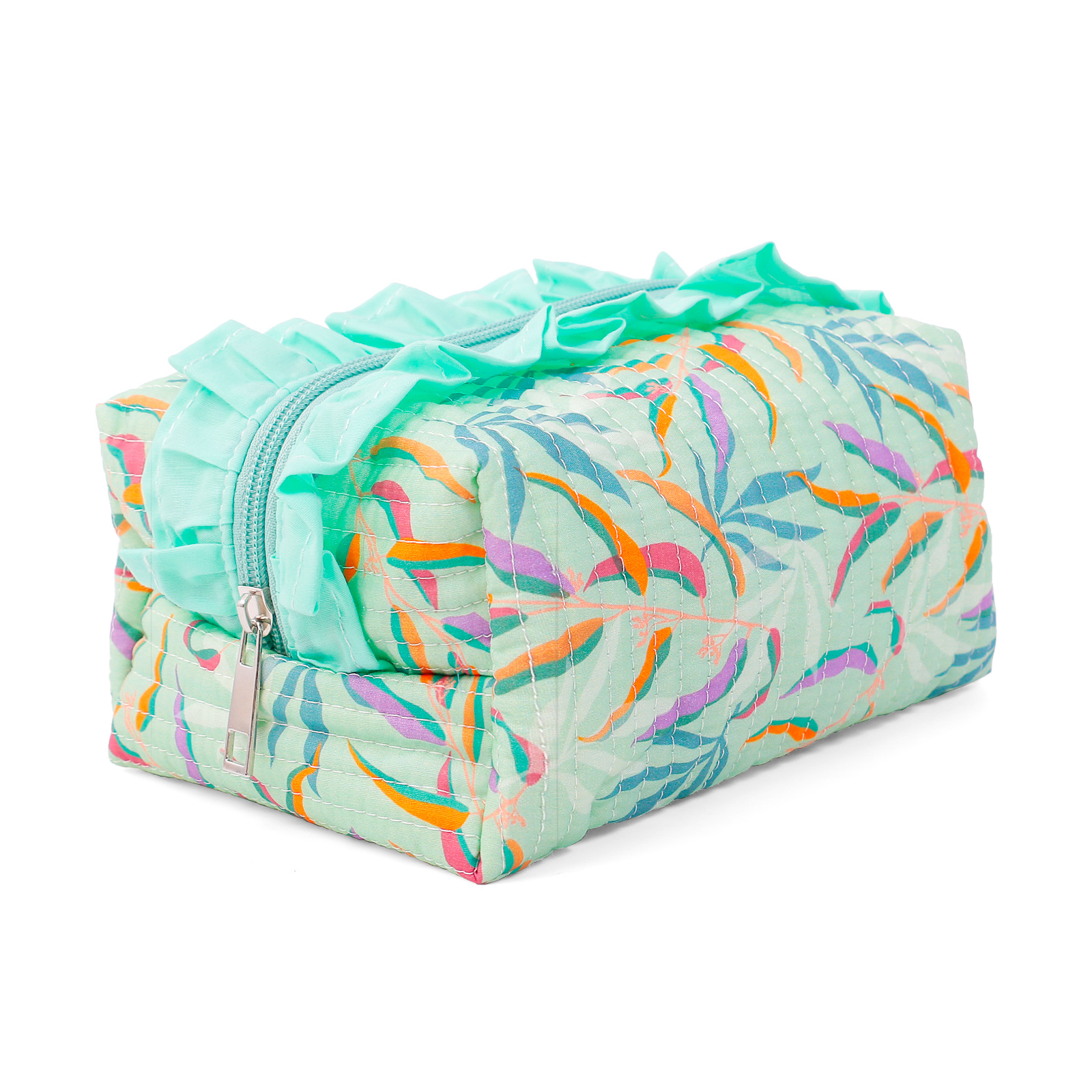 ALT Side angle of a channel-quilted leaf print makeup bag, highlighting the padded 3D shape, the mint ruffle trim, and the silver zipper pull.