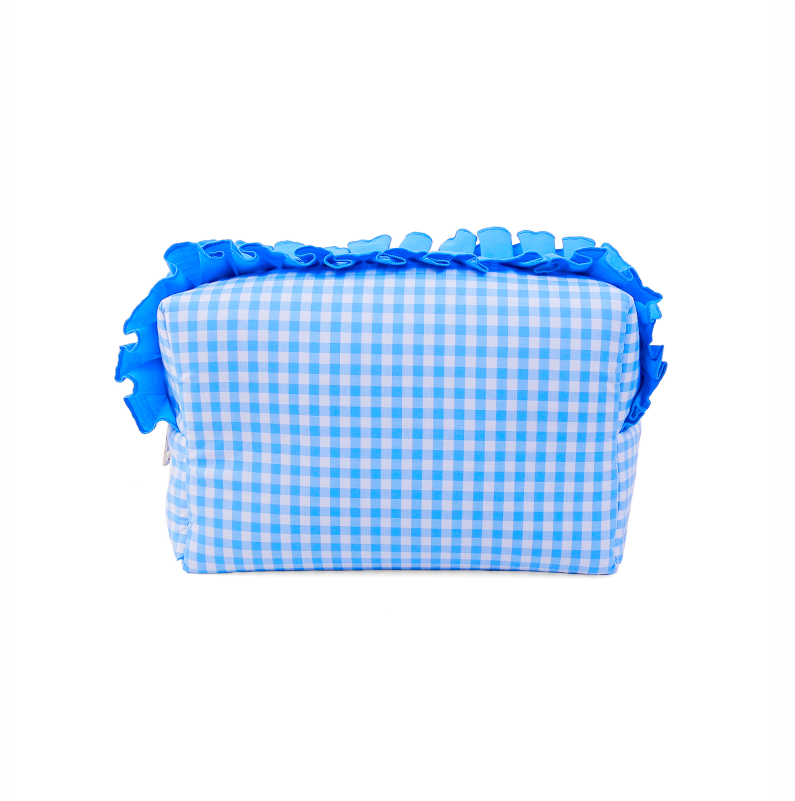 ALT ack view of a blue and white gingham check cotton makeup bag, showing the flat rectangular back panel and the solid blue ruffled trim along the top edg