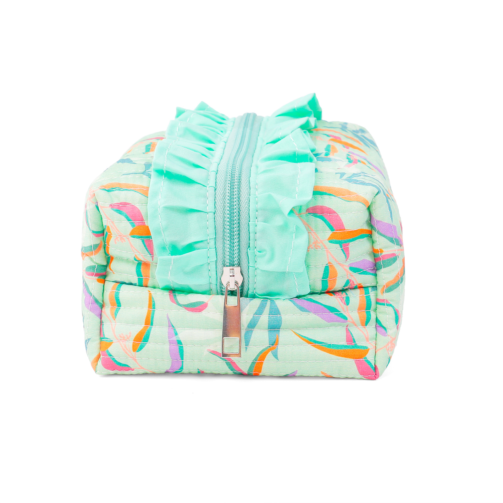 ALT Back view of a quilted cotton washbag with a colorful leaf print in orange, purple, pink, and blue on a mint green background, showing the vertical channel quilted texture