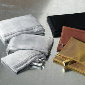 ALT A collection of mesh zipper pouches in silver, black, brown, and gold, arranged on a grey surface, with a silver cosmetic tube and a gold lipstick visible inside the pouches