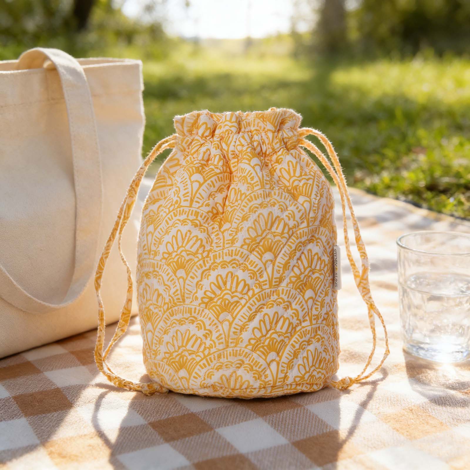 Quilted cotton travel drawstring bag with pockets for beauty essentials